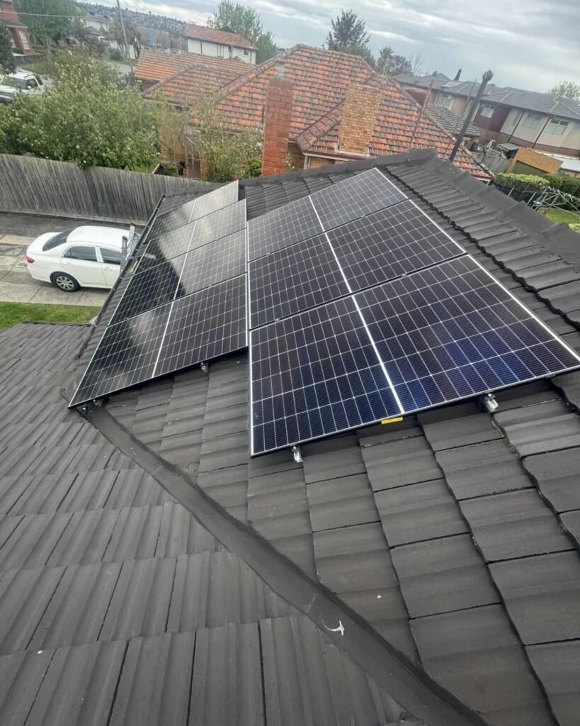 Residential solar panel array installed across a tiled roof